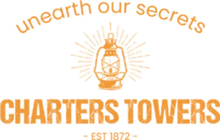 Logo of Charters Towers featuring an old-fashioned lantern with the text "unearth our secrets" and "Charters Towers EST 1872" in orange.